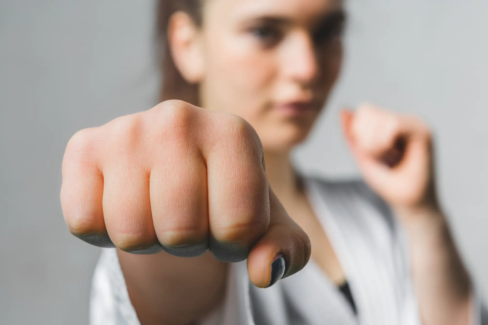 Young Woman Practicing with Karate Martial Art